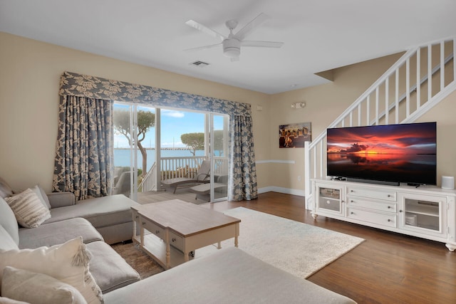 living room with dark hardwood / wood-style floors and ceiling fan