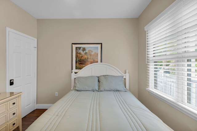 bedroom featuring dark wood-type flooring