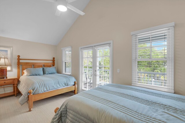 bedroom featuring multiple windows, access to exterior, ceiling fan, and carpet