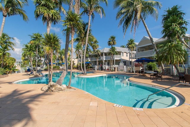 view of swimming pool featuring a patio area