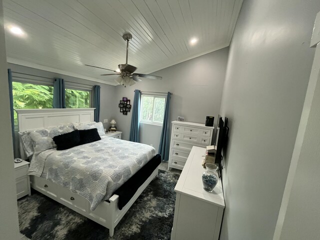 bedroom featuring ceiling fan and wooden ceiling