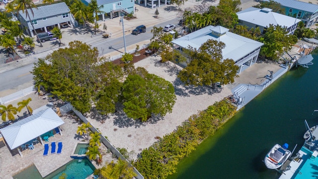 birds eye view of property featuring a water view and a residential view