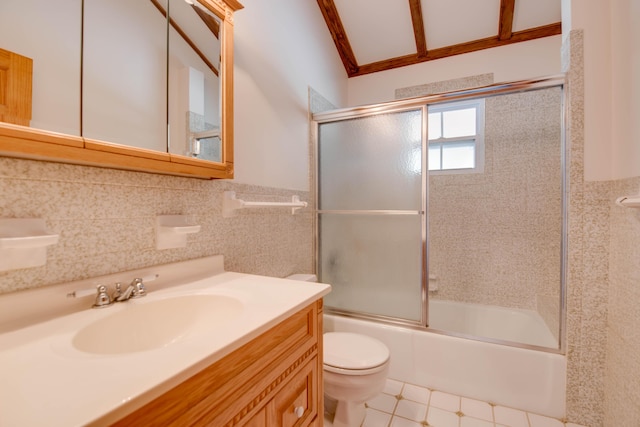 bathroom featuring a wainscoted wall, toilet, tile walls, bath / shower combo with glass door, and vanity