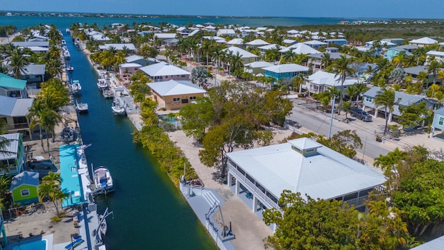 birds eye view of property featuring a residential view and a water view