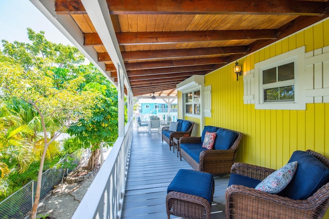 exterior space featuring a balcony and fence