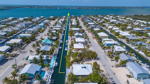 aerial view featuring a water view and a residential view