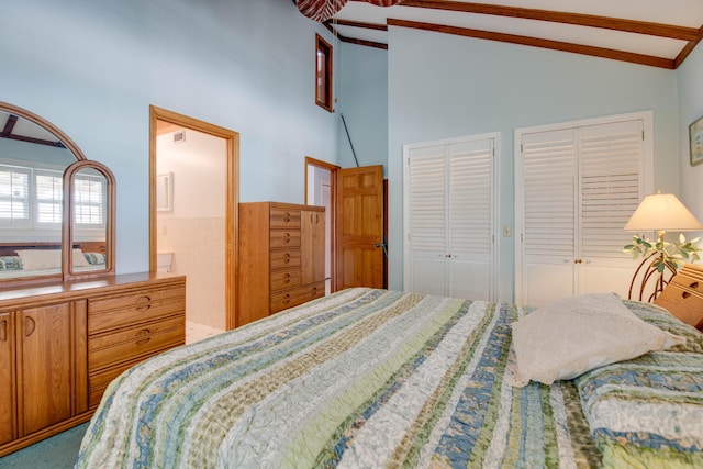 bedroom with beamed ceiling, multiple closets, high vaulted ceiling, and connected bathroom