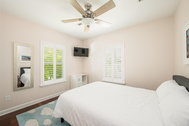 bedroom featuring dark hardwood / wood-style floors and ceiling fan