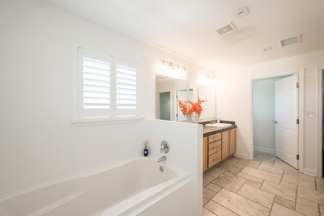 bathroom featuring a bathing tub and vanity