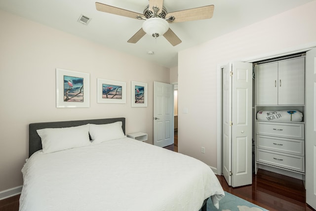 bedroom with ceiling fan and dark hardwood / wood-style flooring