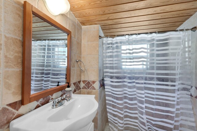 bathroom featuring sink and wooden ceiling