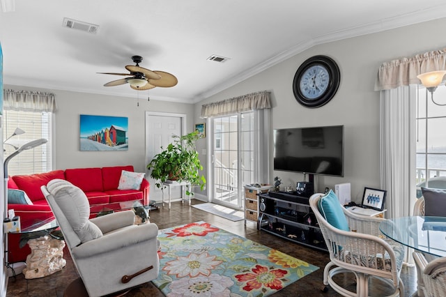 living room with lofted ceiling, crown molding, plenty of natural light, and ceiling fan