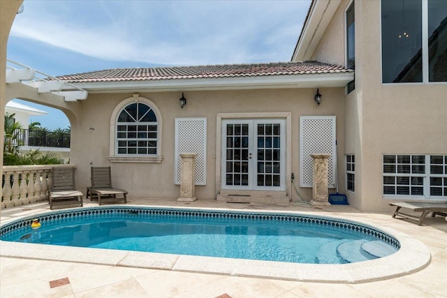 back of house featuring french doors and a patio area