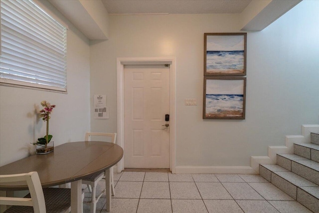 entrance foyer with light tile patterned floors