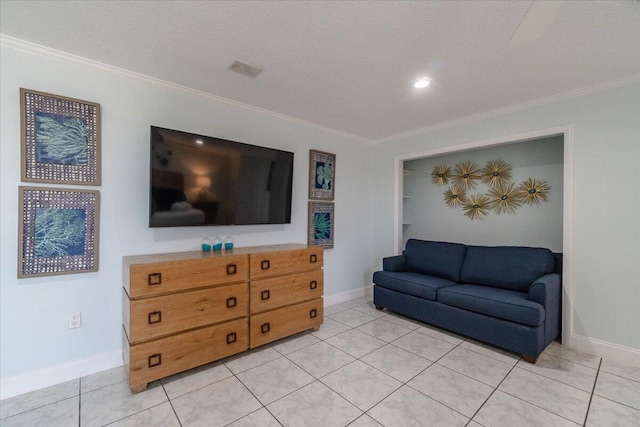 living room with ornamental molding and light tile patterned flooring