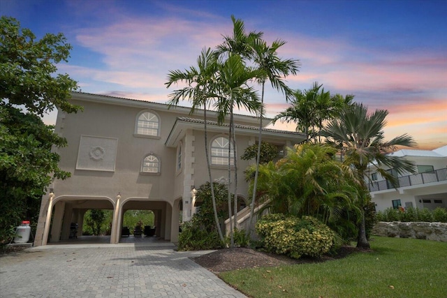 view of outdoor building at dusk