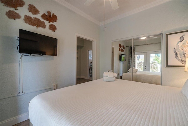 bedroom with a closet, ornamental molding, french doors, and ceiling fan