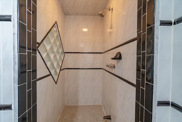 bathroom with tiled shower