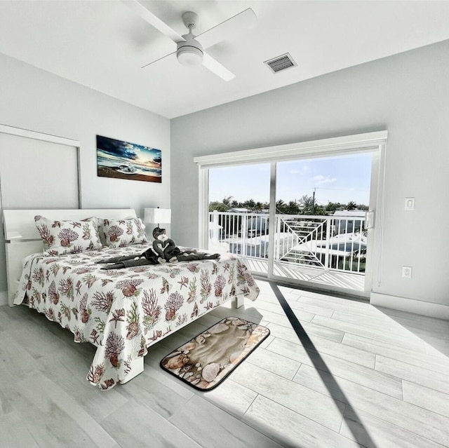 bedroom featuring access to outside and ceiling fan