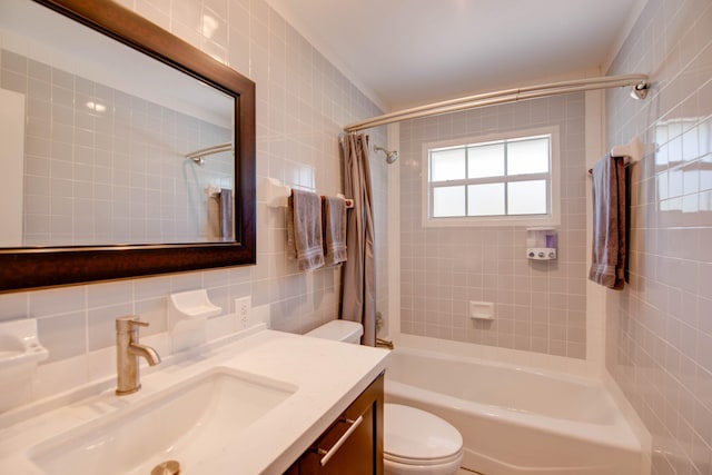 full bathroom with tile walls, vanity, decorative backsplash, toilet, and shower / bath combo with shower curtain