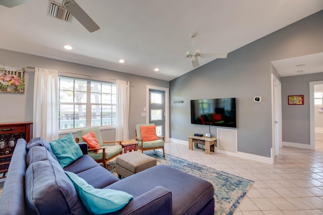 tiled living room with ceiling fan and vaulted ceiling