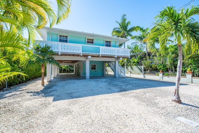 raised beach house with a carport