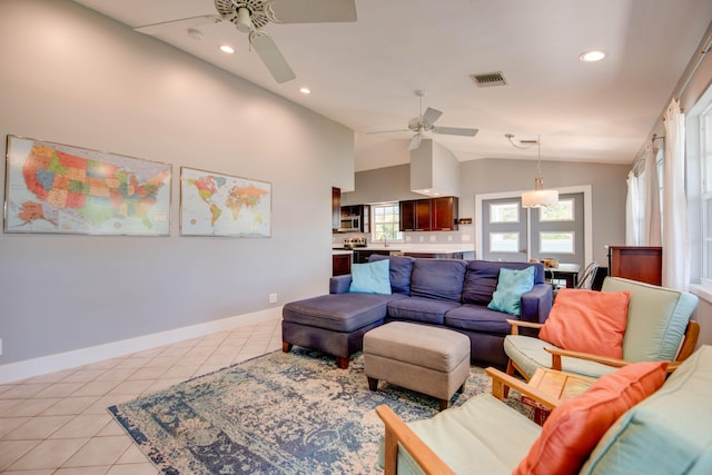 tiled living room featuring sink, vaulted ceiling, and ceiling fan