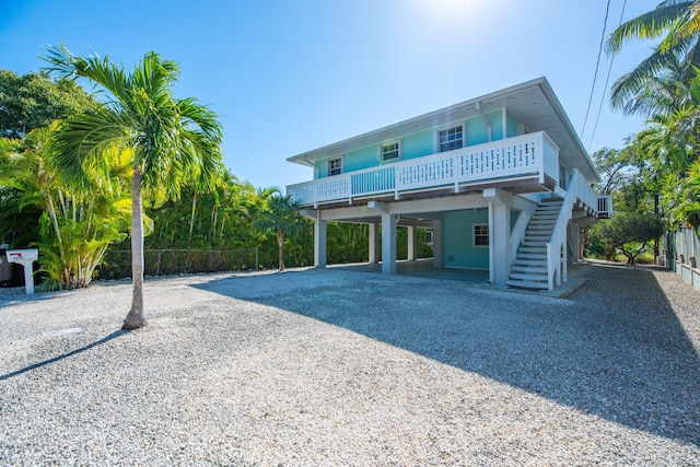 rear view of house featuring a carport