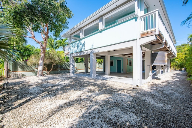 back of property featuring a balcony