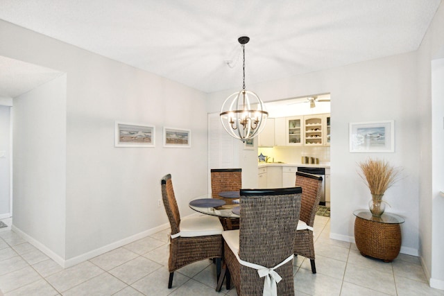 tiled dining area featuring a notable chandelier