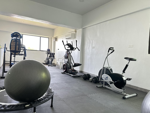 workout room with an AC wall unit