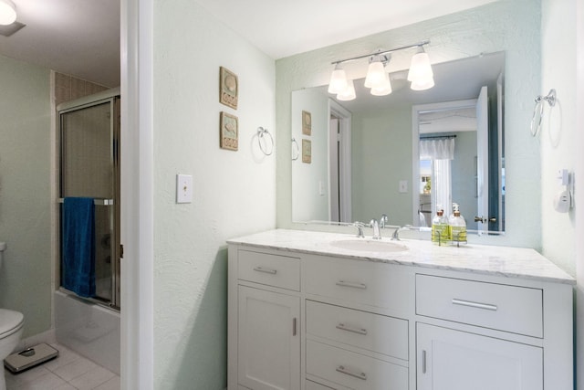 full bathroom featuring vanity, tile patterned floors, toilet, and combined bath / shower with glass door