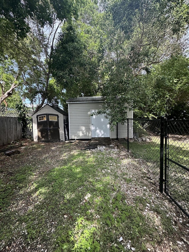 349 Mahogany Dr, Key Largo, FL 33037 - fenced backyard featuring a shed
