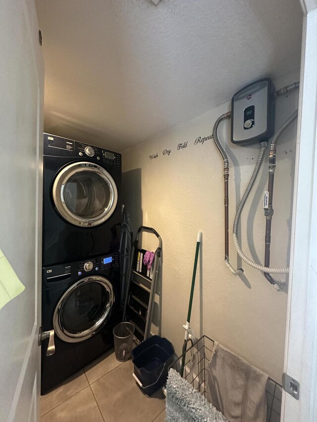 349 Mahogany Dr, Key Largo, FL 33037 - washroom featuring stacked washer / dryer and tile patterned flooring