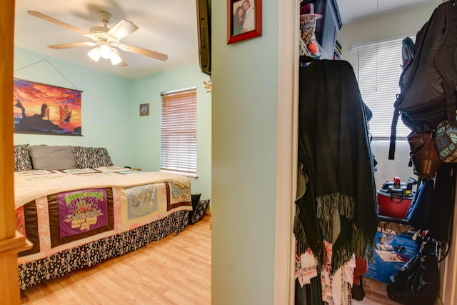 bedroom with ceiling fan and wood finished floors