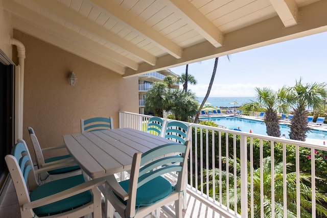 balcony featuring a water view