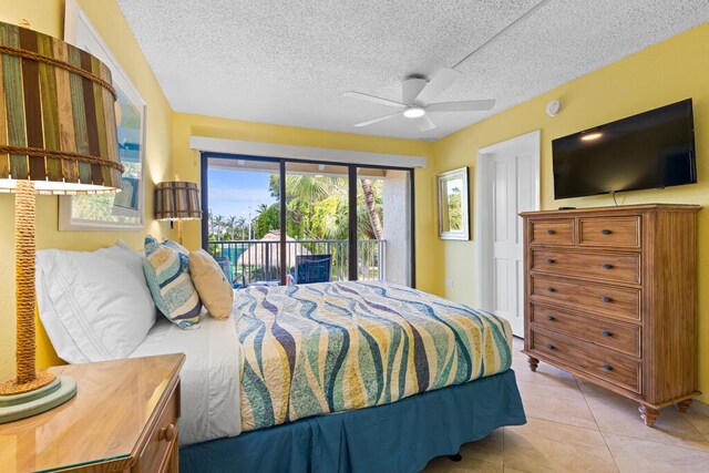 tiled bedroom featuring ceiling fan, a textured ceiling, and access to outside