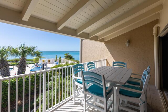 balcony featuring a water view