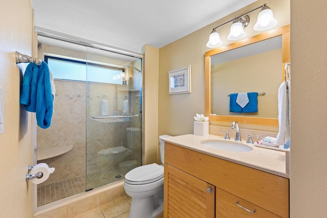 bathroom featuring vanity, tile patterned floors, toilet, and walk in shower