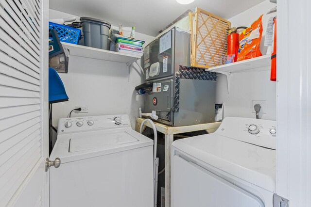 laundry room featuring washing machine and dryer