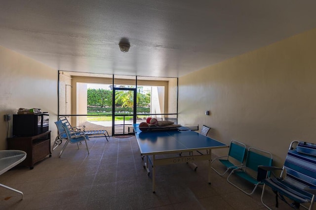 game room with expansive windows