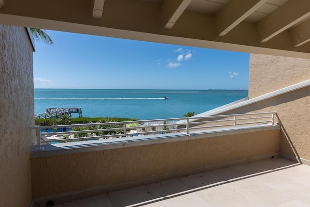 balcony featuring a water view