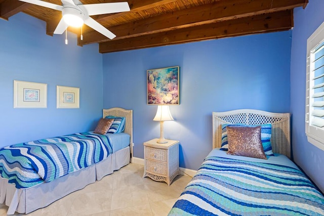 tiled bedroom featuring beamed ceiling, ceiling fan, and wood ceiling