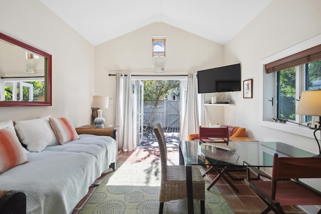 living area with a wealth of natural light and vaulted ceiling