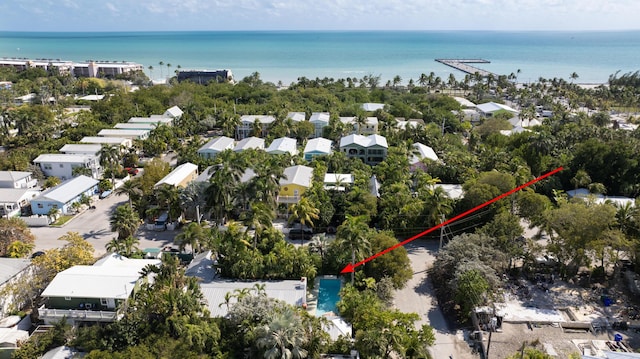 drone / aerial view featuring a water view and a residential view