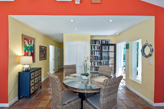 dining room featuring baseboards and recessed lighting