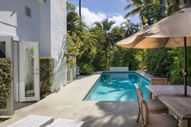 pool with a patio area