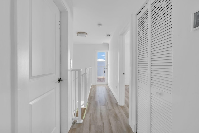 corridor featuring light wood-type flooring