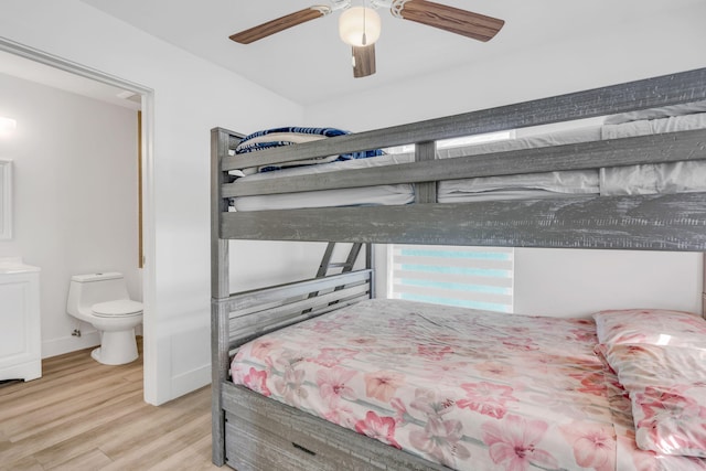 bedroom featuring ceiling fan, connected bathroom, and light hardwood / wood-style floors