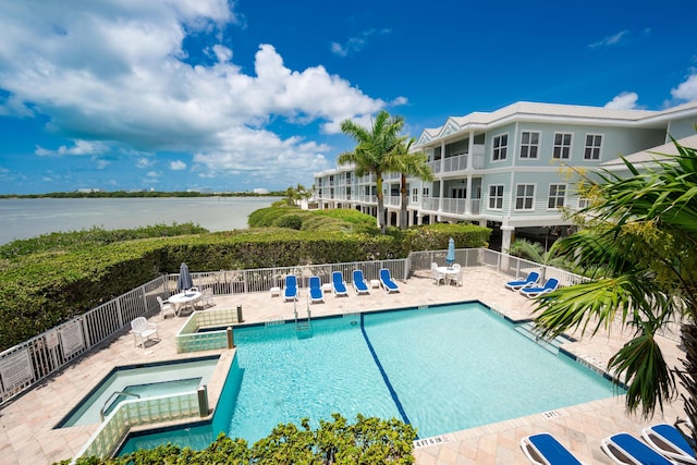 5960 Peninsular Ave Unit 108, Stock Island, FL 33040 - view of pool featuring a patio area, fence, and a water view